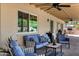 This patio offers a comfortable lounging area, shade, and great views of the backyard at 7202 N 16Th Dr, Phoenix, AZ 85021