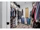 Walk-in closet with custom shelving, hanging racks, and organizational storage at 7202 N 16Th Dr, Phoenix, AZ 85021