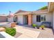 Charming home exterior with a red door, brick accents, and a well-maintained yard at 7318 S Mcallister Ave, Tempe, AZ 85283