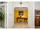 Hallway with light-filled entry showcases decorative elements leading to brightly colored room at 7318 S Mcallister Ave, Tempe, AZ 85283