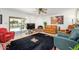 Cozy living room with a fireplace, tile floors, stylish decor, and sliding glass doors at 7318 S Mcallister Ave, Tempe, AZ 85283