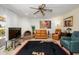 Cozy living room features a brick fireplace, comfortable seating, and stylish decor at 7318 S Mcallister Ave, Tempe, AZ 85283