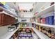 Walk-in pantry with plentiful shelving offers ample storage for food items and kitchen essentials at 7318 S Mcallister Ave, Tempe, AZ 85283
