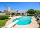 Beautiful backyard with a diving pool, well-kept lawn, mature trees, and an outdoor lounge area at 7318 S Mcallister Ave, Tempe, AZ 85283