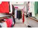 Organized walk-in closet with multi-tiered rods and shelves for efficient storage and display at 7318 S Mcallister Ave, Tempe, AZ 85283