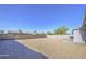 Backyard with gravel groundcover and block fence provides privacy and space at 7332 W Desert Cove Ave, Peoria, AZ 85345
