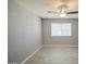 Bedroom featuring light wood-look floors, grey walls, a ceiling fan, and a window at 7332 W Desert Cove Ave, Peoria, AZ 85345