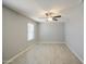 Bedroom featuring light wood-look floors, grey walls, a ceiling fan, and a window at 7332 W Desert Cove Ave, Peoria, AZ 85345