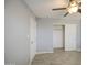 This bedroom features neutral walls, wood look floors, ceiling fan, and closet at 7332 W Desert Cove Ave, Peoria, AZ 85345