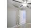 A bedroom view of a ceiling fan, neutral walls, wood look floors, and a door to the rest of the house at 7332 W Desert Cove Ave, Peoria, AZ 85345