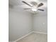 A bedroom featuring a ceiling fan, neutral walls, and wood look floors at 7332 W Desert Cove Ave, Peoria, AZ 85345