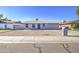 Inviting single-story home featuring a low-maintenance gravel front yard and well-kept exterior at 7332 W Desert Cove Ave, Peoria, AZ 85345