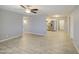 Open living space with tile floors leading to kitchen with stainless steel appliances at 7332 W Desert Cove Ave, Peoria, AZ 85345