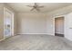 Spacious carpeted bedroom with access to private balcony and ensuite bathroom at 7601 E Indian Bend Rd # 3002, Scottsdale, AZ 85250
