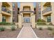 Attractive building exterior with well-manicured landscaping and a charming water feature at the entrance at 7601 E Indian Bend Rd # 3002, Scottsdale, AZ 85250
