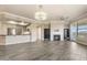Open-concept living area with fireplace, kitchen access, and neutral tones, creating a welcoming and functional space at 7601 E Indian Bend Rd # 3002, Scottsdale, AZ 85250