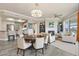 Inviting open-concept living space with a fireplace, breakfast bar, and elegant dining area, perfect for entertaining at 7601 E Indian Bend Rd # 3002, Scottsdale, AZ 85250