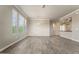 Bright, open living area with large windows, neutral paint, and tiled floors, flowing into the kitchen at 7601 E Indian Bend Rd # 3002, Scottsdale, AZ 85250