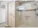 Contemporary walk-in shower with white tile and glass door at 7601 E Indian Bend Rd # 3002, Scottsdale, AZ 85250