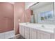 Bathroom showcasing double sinks with white cabinets and a large mirror with vanity lights at 786 S Catalina St, Gilbert, AZ 85233