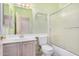 Bathroom featuring a shower-tub combo, toilet, vanity, and medicine cabinet at 786 S Catalina St, Gilbert, AZ 85233