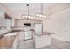 Well-lit kitchen featuring tile floors, an island with countertop, and modern appliances at 786 S Catalina St, Gilbert, AZ 85233