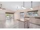 Eat-in kitchen with tile floors, island with countertop, and access to a bright living space at 786 S Catalina St, Gilbert, AZ 85233