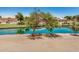 Scenic view of a serene lake framed by mature trees and well-maintained landscaping at 786 S Catalina St, Gilbert, AZ 85233