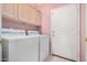 Laundry room with a side-by-side washer and dryer and cabinet storage at 786 S Catalina St, Gilbert, AZ 85233