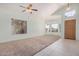 Bright living room featuring neutral carpet, tile flooring, a bay window and lots of natural light at 786 S Catalina St, Gilbert, AZ 85233