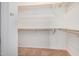 Spacious walk-in closet featuring carpeted floors and wooden shelves at 786 S Catalina St, Gilbert, AZ 85233