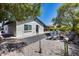Backyard features a bocce ball court, desert landscaping, a fire pit, and an outdoor seating area at 8625 E San Alfredo Dr, Scottsdale, AZ 85258