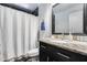 Stylish bathroom with granite vanity, updated fixtures, and a shower with a curtain at 8625 E San Alfredo Dr, Scottsdale, AZ 85258