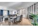 Open-concept dining area showcasing stylish decor, an elegant dining set, and seamless flow into the living space at 8625 E San Alfredo Dr, Scottsdale, AZ 85258