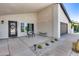 Inviting front porch with seating area, decorative wreath on the front door, and well-maintained desert landscaping at 8625 E San Alfredo Dr, Scottsdale, AZ 85258