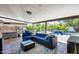 Inviting covered patio with comfortable seating, outdoor grill, and view of the pool area, perfect for entertaining at 8625 E San Alfredo Dr, Scottsdale, AZ 85258