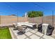 Cozy backyard patio area with comfortable seating, grill, and stylish pavers at 902 E Wahalla Ln, Phoenix, AZ 85024