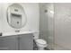 Updated bathroom featuring stylish tiles, modern fixtures, and a glass-enclosed shower at 902 E Wahalla Ln, Phoenix, AZ 85024