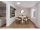 Chic dining area featuring a modern table set, wood flooring, and custom design elements at 902 E Wahalla Ln, Phoenix, AZ 85024