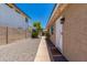 Exterior view of home with charming walkway, decorative rock landscaping, and inviting entryway at 902 E Wahalla Ln, Phoenix, AZ 85024