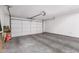 Clean and spacious two-car garage with a painted floor and an automatic door at 902 E Wahalla Ln, Phoenix, AZ 85024