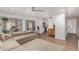 Bright living room with light wood floors, a sectional sofa, and an open layout at 902 E Wahalla Ln, Phoenix, AZ 85024