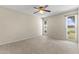 Bright bedroom with two windows offering natural light and views of the surrounding property at 9434 W Greenway Rd, Sun City, AZ 85351