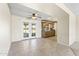 Cozy dining room with tiled flooring and French doors that open to the backyard at 9434 W Greenway Rd, Sun City, AZ 85351