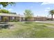 Attractive single-level home boasts a manicured front yard and an attached garage for easy access at 9434 W Greenway Rd, Sun City, AZ 85351