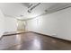 A spacious garage has ample room with access to a laundry area and side window for natural light at 9434 W Greenway Rd, Sun City, AZ 85351