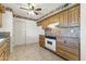 Well-lit kitchen featuring wooden cabinets and modern appliances, perfect for home cooking at 9434 W Greenway Rd, Sun City, AZ 85351