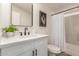 Stylish bathroom with quartz countertop, matte black fixtures, and framed mirror at 9735 W Altadena Dr, Casa Grande, AZ 85194