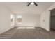 Bright bedroom filled with natural light, neutral carpet and scenic views at 9735 W Altadena Dr, Casa Grande, AZ 85194