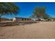 Exterior view of the residence with desert landscaping and a clear blue sky at 9735 W Altadena Dr, Casa Grande, AZ 85194